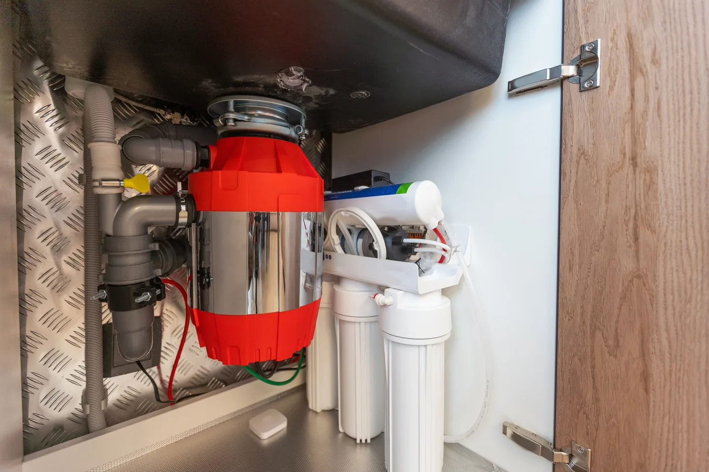 Garbage disposal installed under a kitchen sink